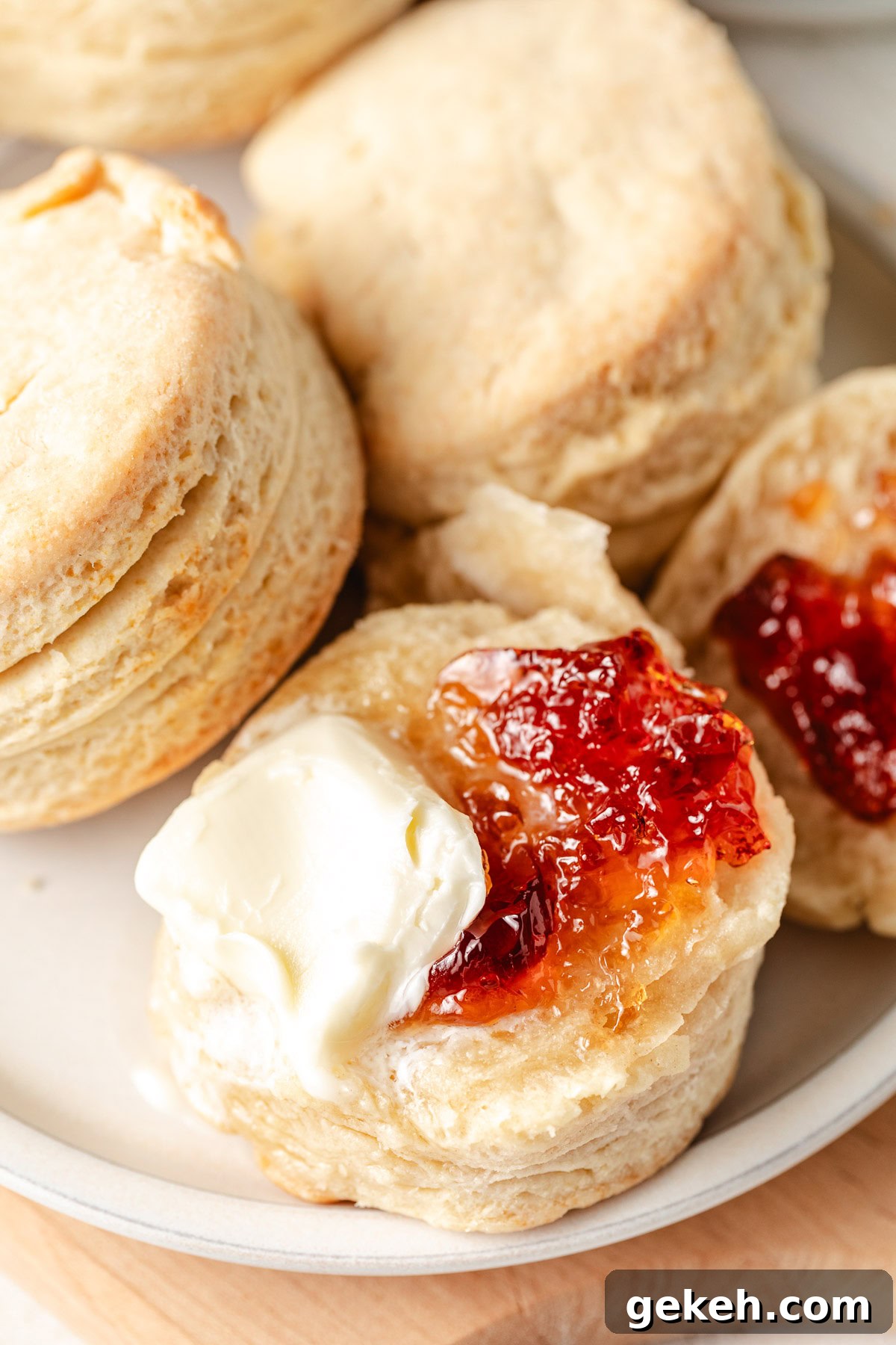 Perfectly Flaky Homemade Biscuits Recipe 2 Butter and jelly on a homemade biscuit.