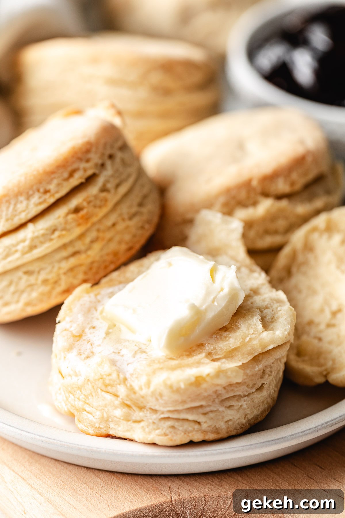Perfectly Flaky Homemade Biscuits Recipe 3 Butter on a homemade biscuit.