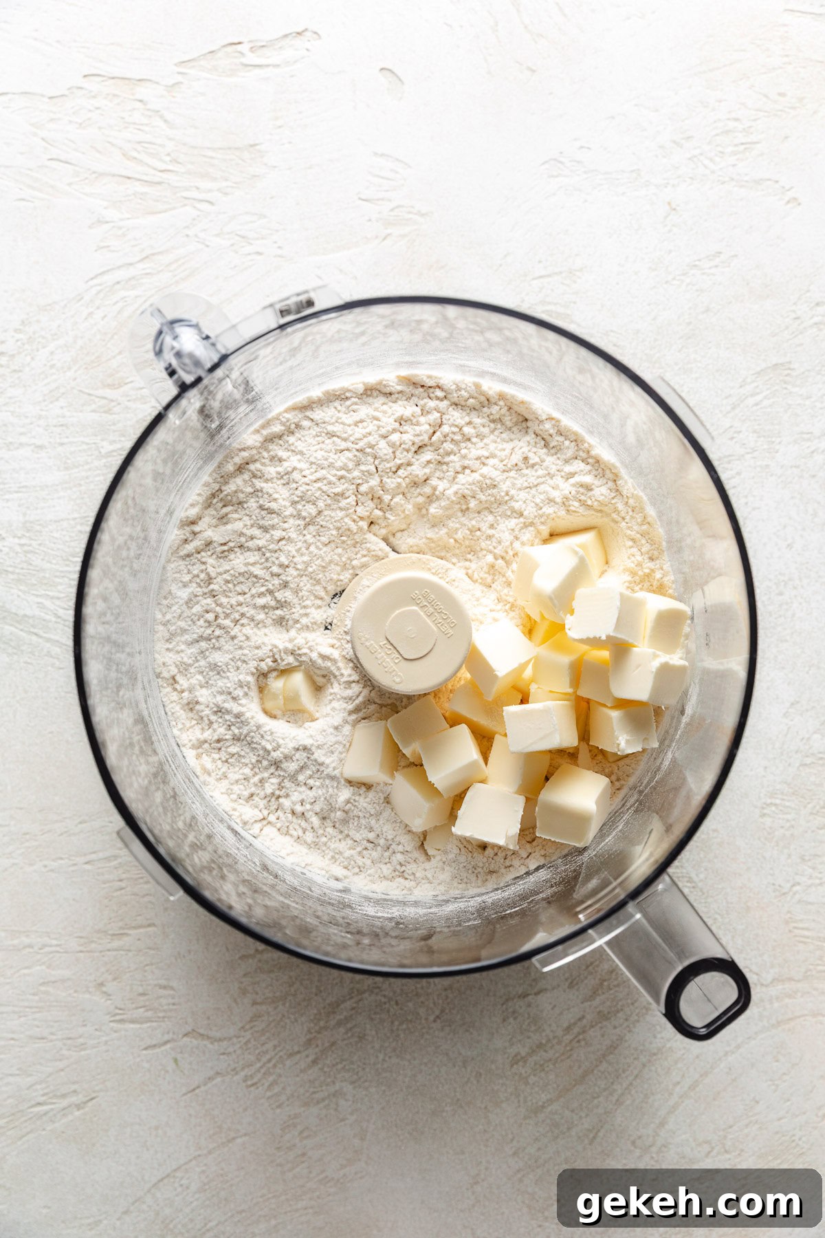 Perfectly Flaky Homemade Biscuits Recipe 4 Cubed butter on top of flour, baking powder and salt.