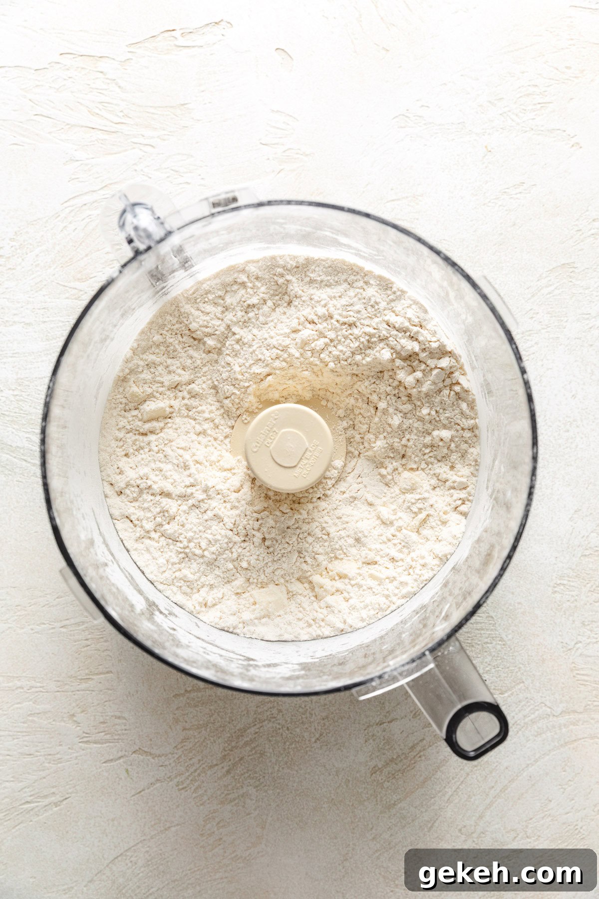 Perfectly Flaky Homemade Biscuits Recipe 5 Butter mixed with flour, baking powder, and salt.