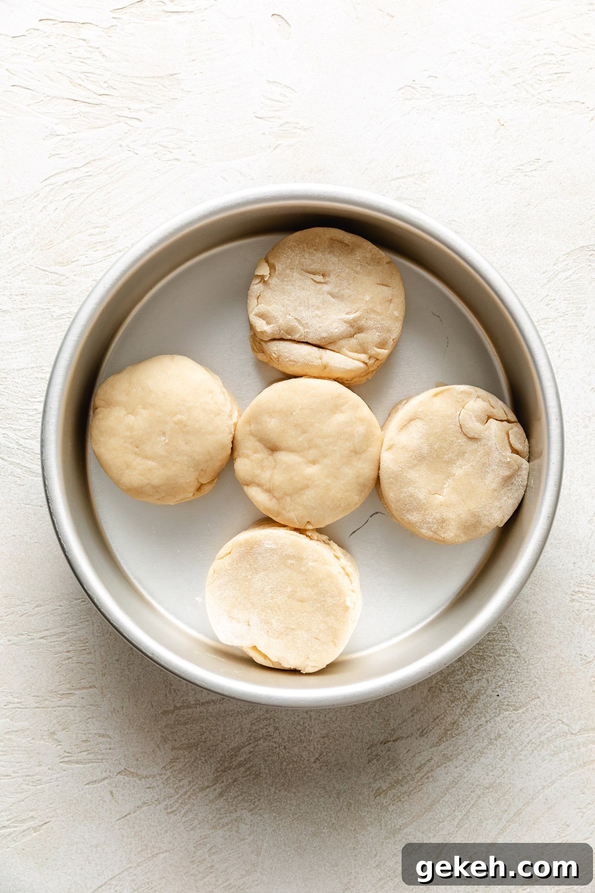 Perfectly Flaky Homemade Biscuits Recipe 7 Unbaked biscuit dough in a pan.