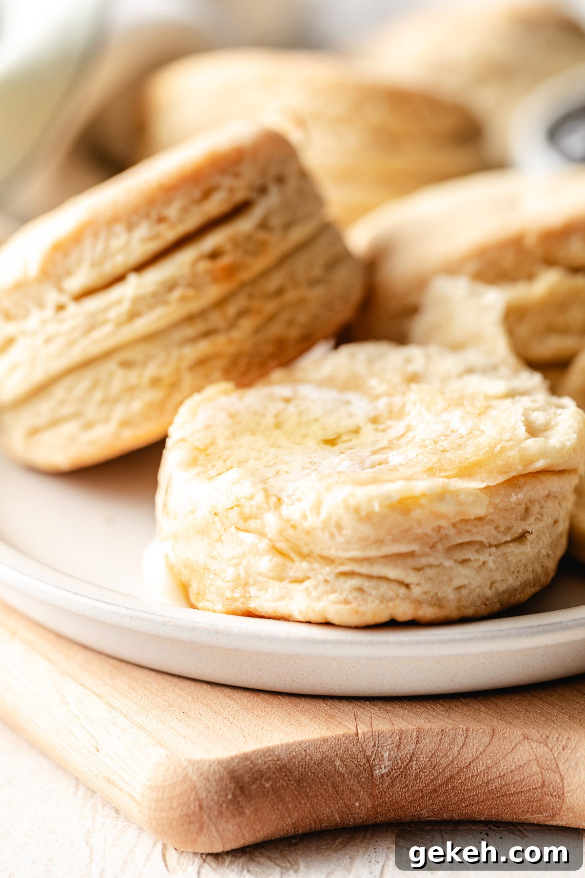 Perfectly Flaky Homemade Biscuits Recipe 8 Buttermilk biscuits on a plate.