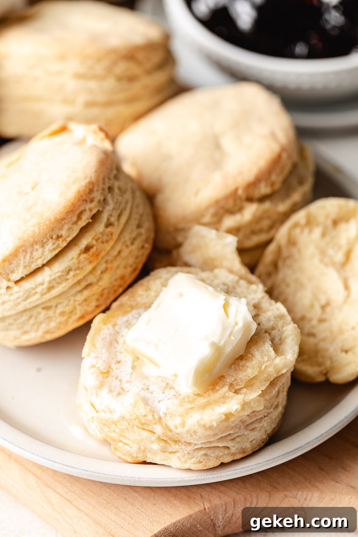 Perfectly Flaky Homemade Biscuits Recipe 10 Pat of butter on a biscuit.