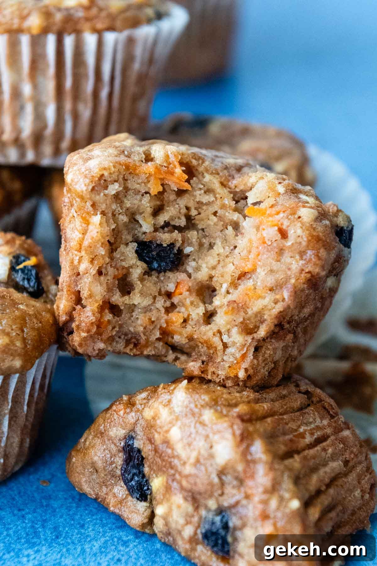 a bite taken out of a muffin stacked on other muffins.