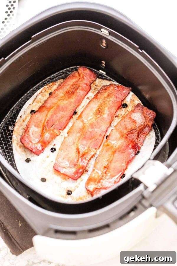 The easiest way to prepare bacon is in the Air Fryer. Done in no time. The ultimate set and forget recipe.