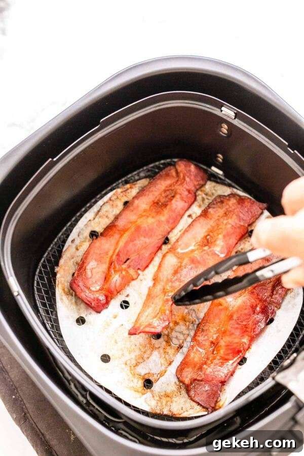 Air Fryer bacon. Done in no time and no smoke, less fat and crispy, crunchy bacon all the time.