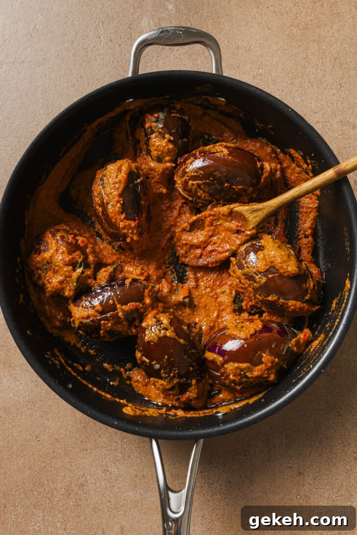 Bagara Baingan: Authentic South Indian Eggplant Curry Recipe 14 Bagare Baingan in a skillet ready to be simmered.