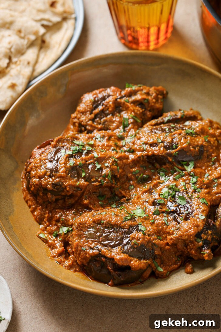 Bagara Baingan: Authentic South Indian Eggplant Curry Recipe 6 Bagare Baingan in a plate garnished with minced cilantro.