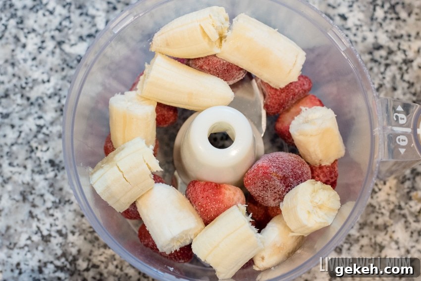 Strawberries and bananas in a food processor