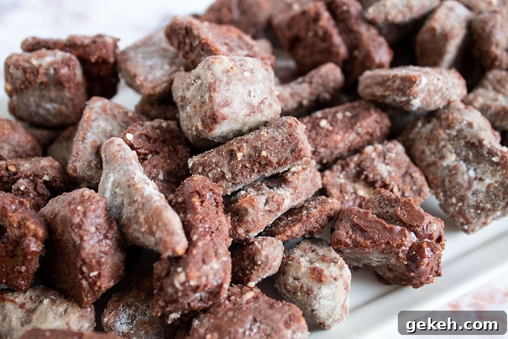 Keto Puppy Chow Recipe: Low-Carb Muddy Buddies Snack 7 closeup of keto puppy chow on a white serving platter