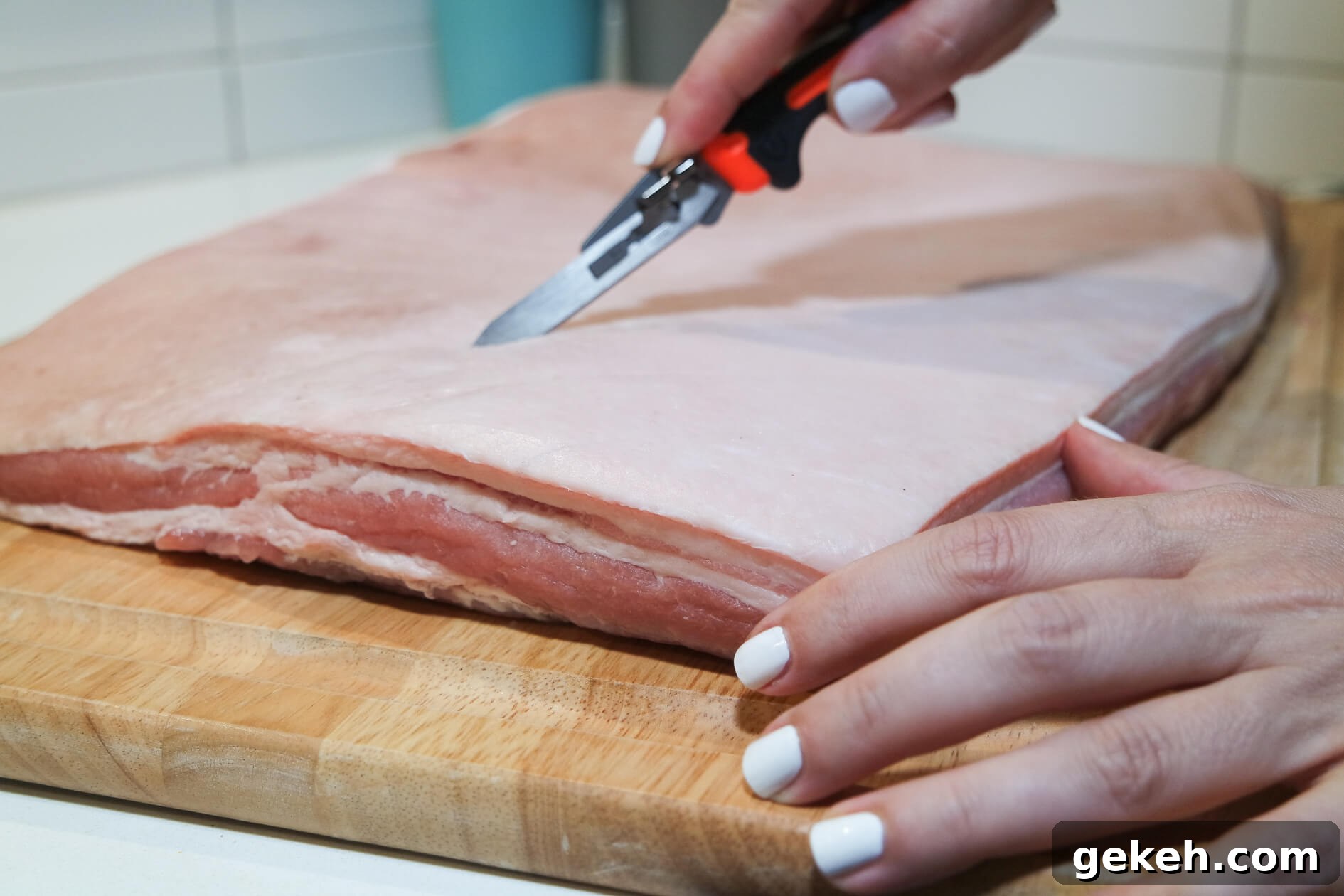 Crispy-Skinned Pork Belly Porchetta Recipe 2 scoring the pork belly skin with gerber vital