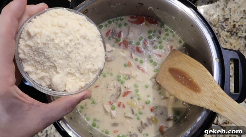Adding grated Parmesan into pot