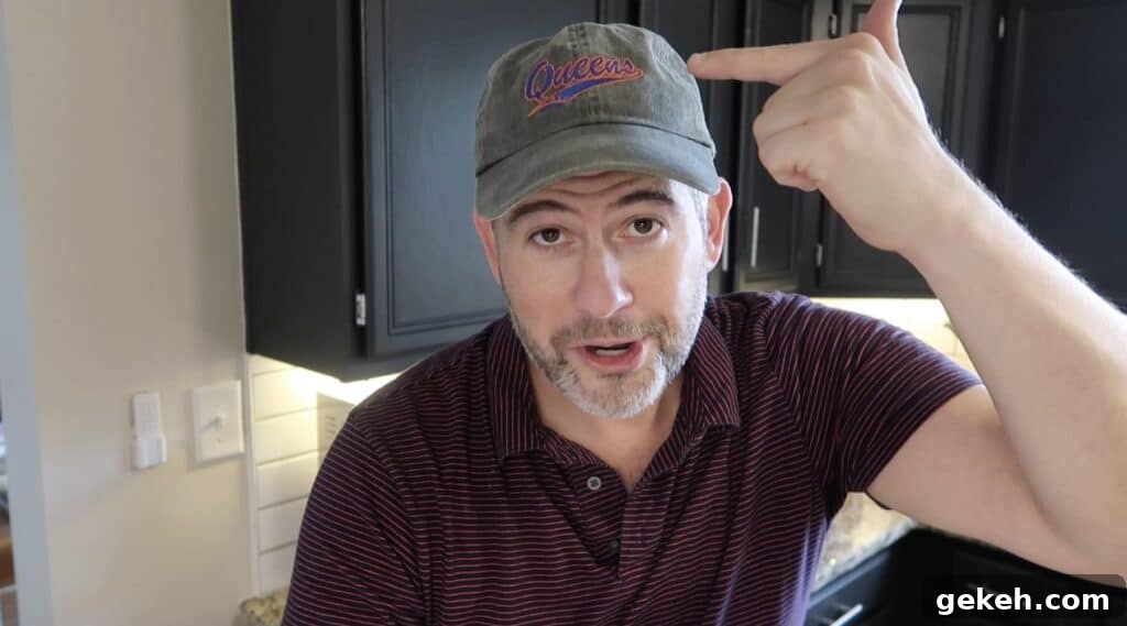 Man showing Queens hat