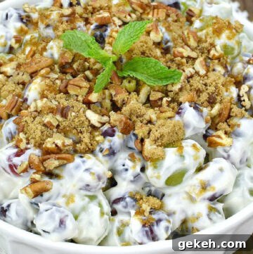 grape salad topped with crushed pecans in a bowl