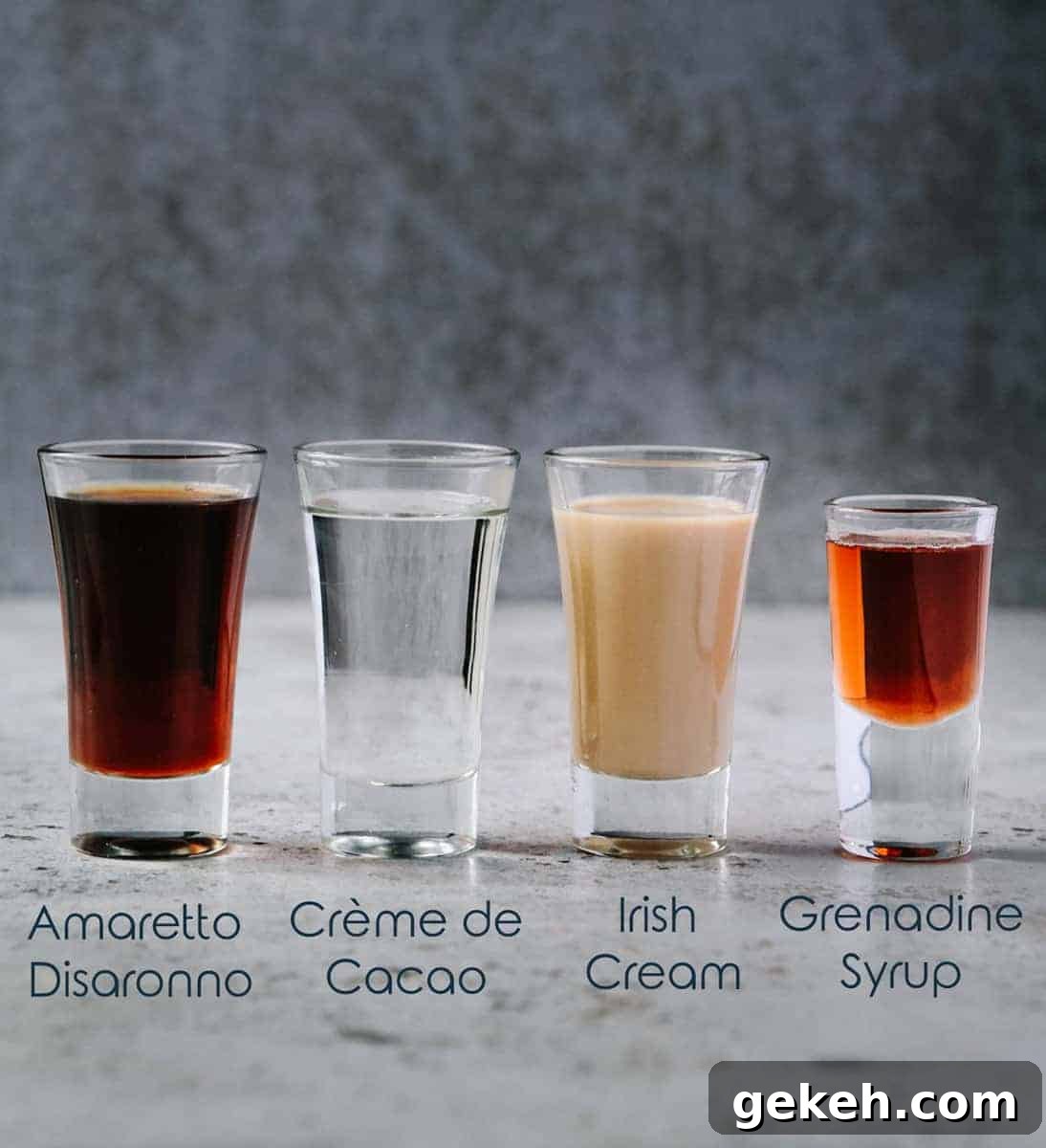 Four small glasses with different alcohol ingredients for jellyfish shot