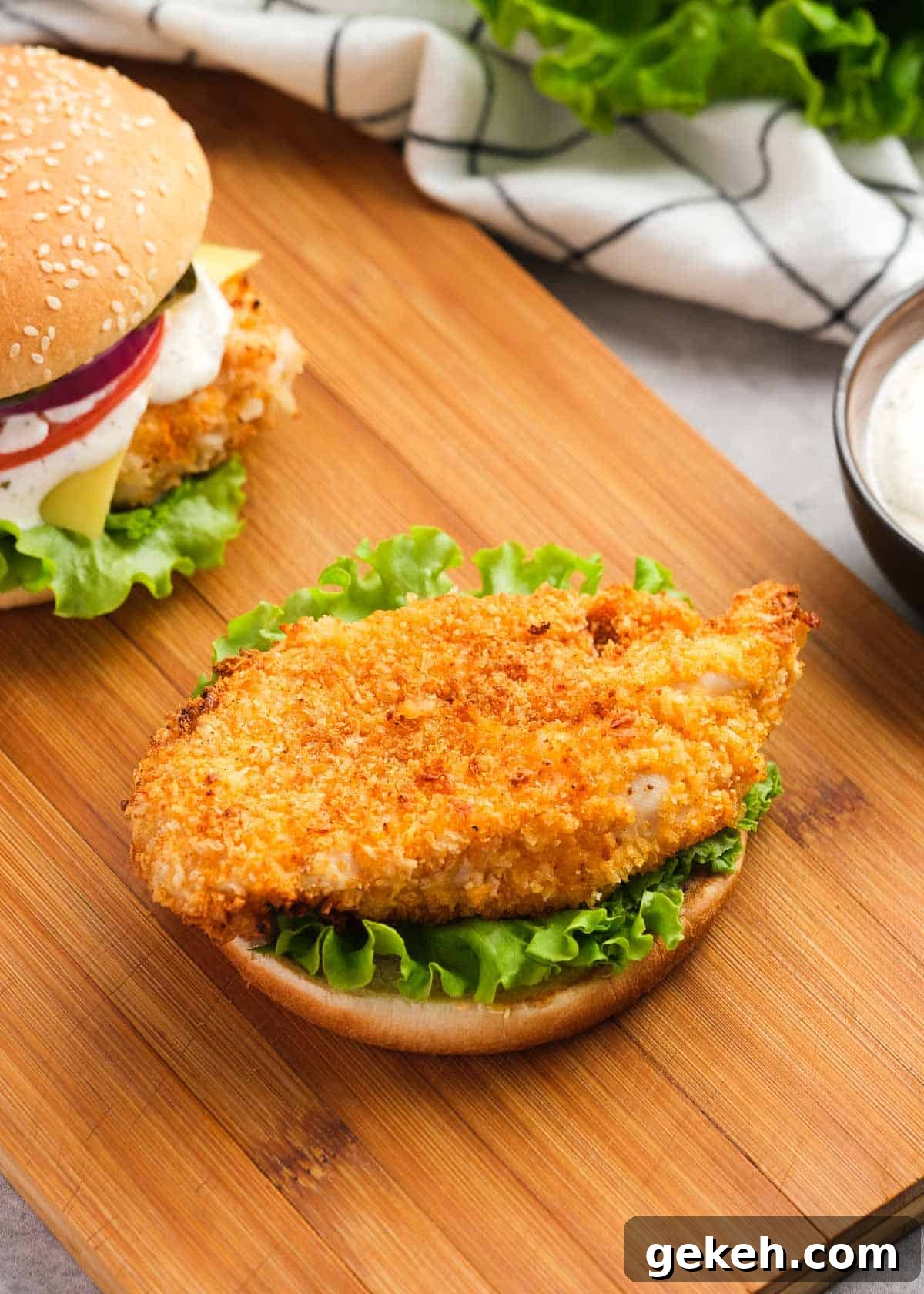 Crispy Air Fryer Chicken Sandwich Recipe 4 a crispy chicken fillet lying on a bed of lettuce and bun, waiting for other chicken sandwich toppings.