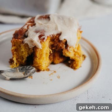 Pumpkin Cinnamon Rolls with Brown Butter Frosting Recipe 6 one cinnamon bun on a plate with frosting