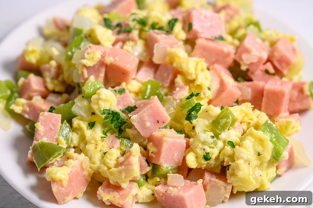 Savory Spam and Scrambled Eggs Recipe for Quick Breakfast 6 6 Ingredient Spam Scrambled Eggs on a plate.