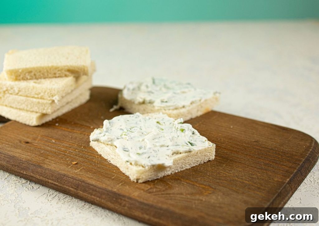 Refreshing Cucumber and Dill Tea Sandwiches for Entertaining 6 Cream cheese being spread on bread.