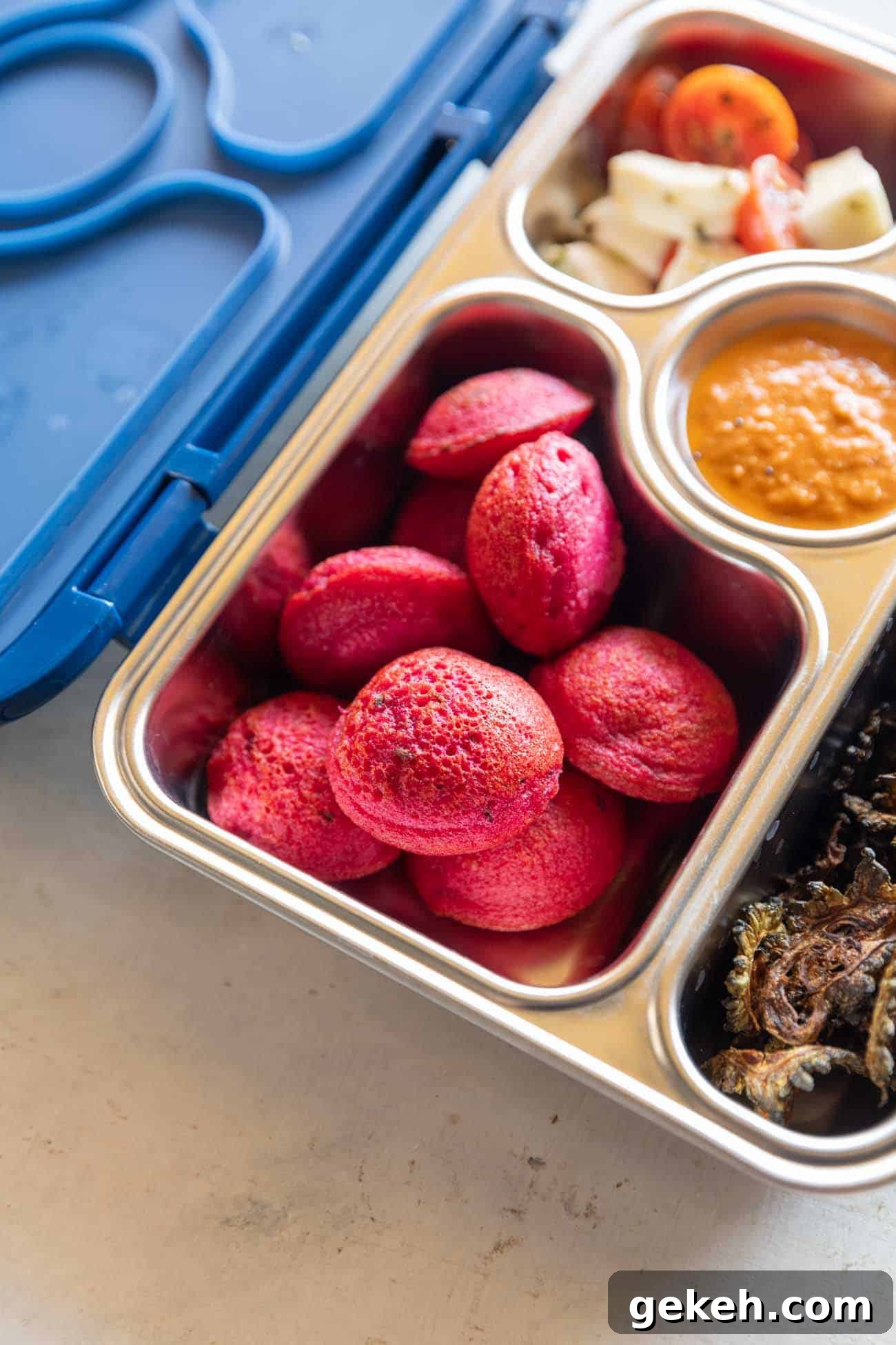 Beetroot paniyaram in a tiffin box