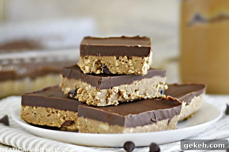 no bake chocolate peanut butter bars stacked on a white plate
