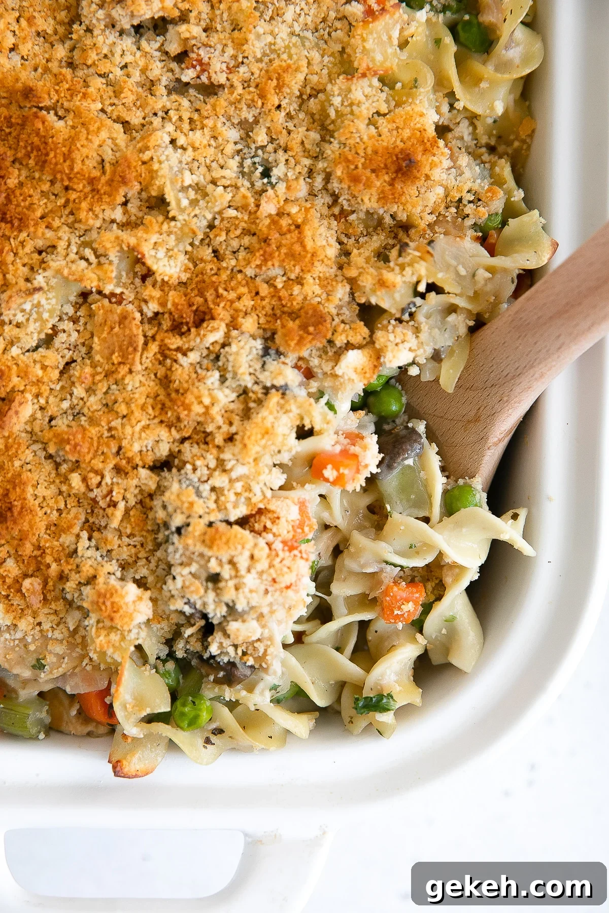 Classic Tuna Noodle Casserole Recipe for Comforting Weeknight Meals 2 Crispy golden casserole made with canned tuna, noodles, and a homemade sauce with frozen peas and carrots.