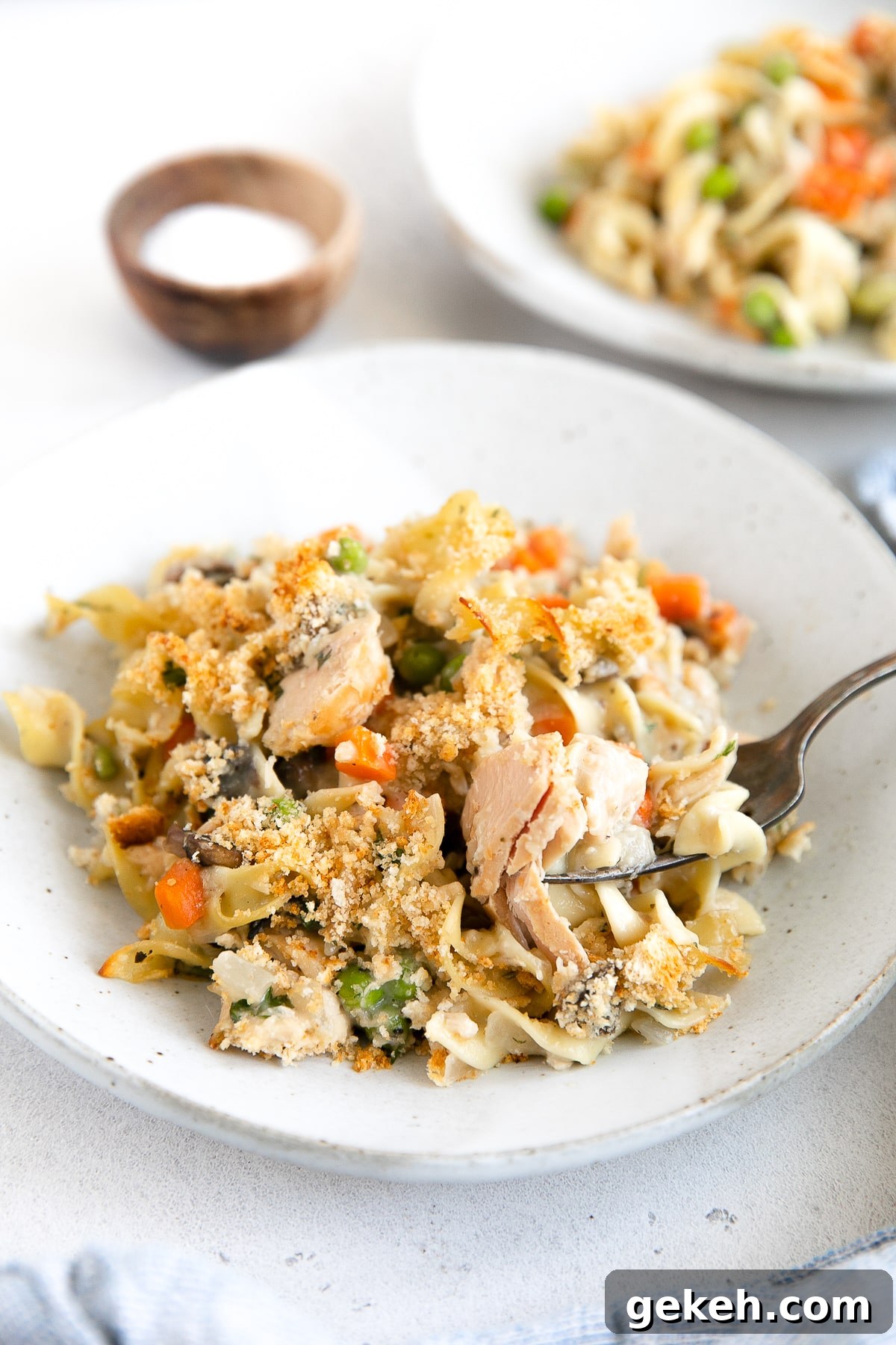 Classic Tuna Noodle Casserole Recipe for Comforting Weeknight Meals 9 Plate filled with a large serving of tuna noodle casserole.