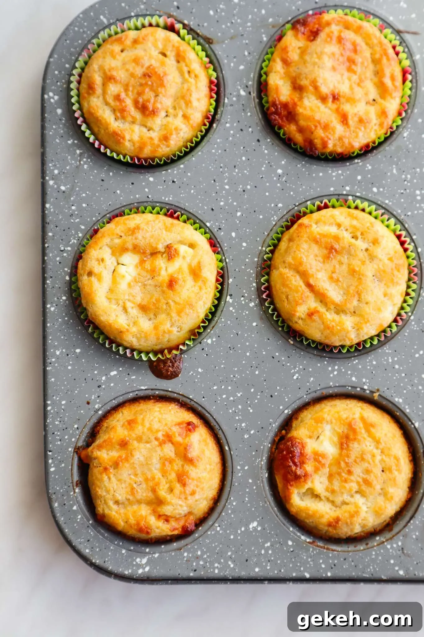 Flourless savoury oatmeal feta muffins! This easy savoury breakfast muffin recipe is simple, gluten free and so delicious! If you're looking for some new easy meal prep breakfast ideas, you've got to try these feta muffins!