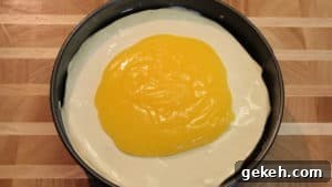 Creamy Lemon Cheesecake Recipe: Zesty Slice of Perfection 14 lemon glaze on cheesecake