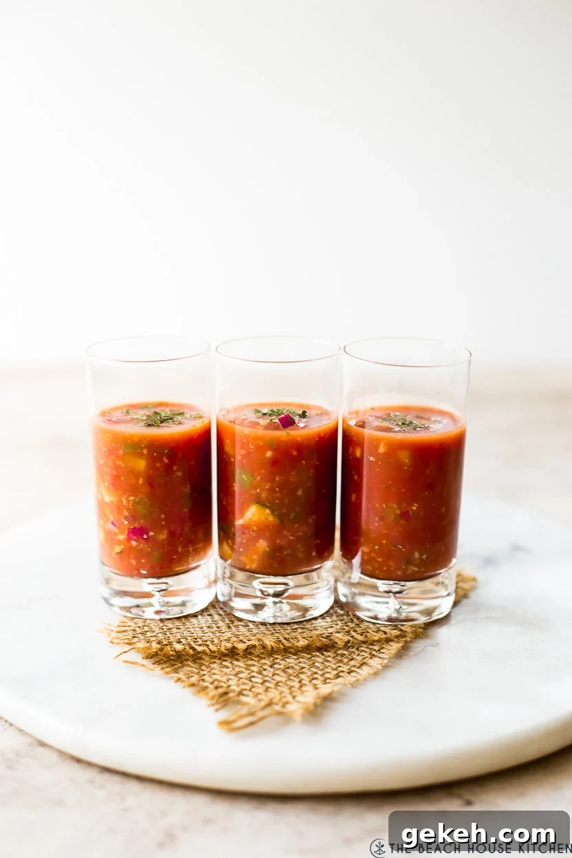Authentic Spanish Gazpacho Recipe: Refreshing Cold Tomato Soup 4 Three shooter glasses filled with gazpacho