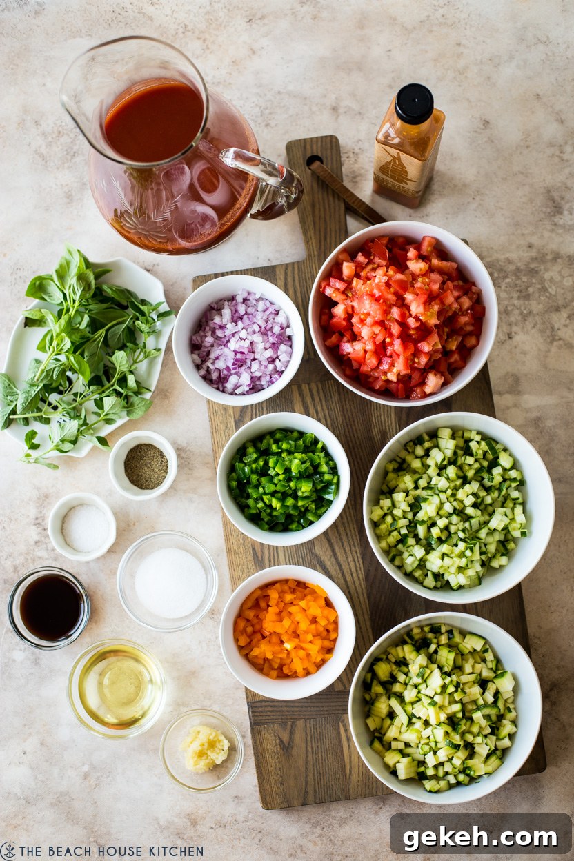 Authentic Spanish Gazpacho Recipe: Refreshing Cold Tomato Soup 6 Overhead photo of ingredients for gazpacho in individual bowls