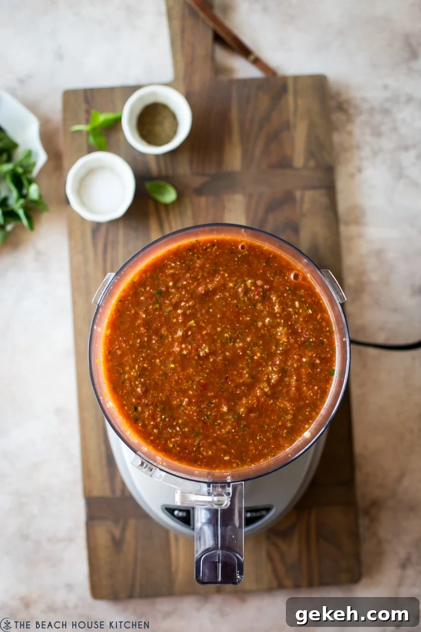Authentic Spanish Gazpacho Recipe: Refreshing Cold Tomato Soup 7 A food processor filled with gazpacho