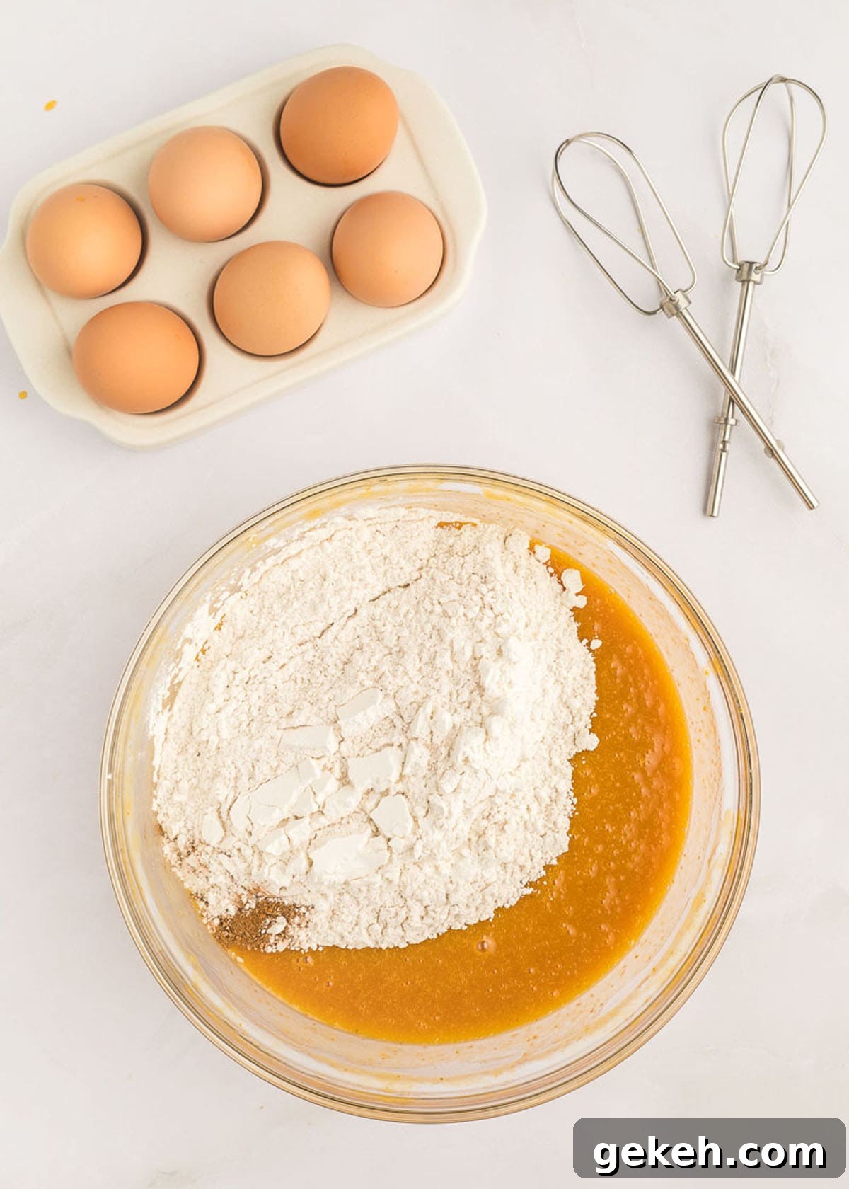 Moist Pumpkin Sheet Cake Recipe with Cream Cheese Frosting 12 The flour, egg, and pumpkin cake spice mixture added to the eggs and canned pumpkin.