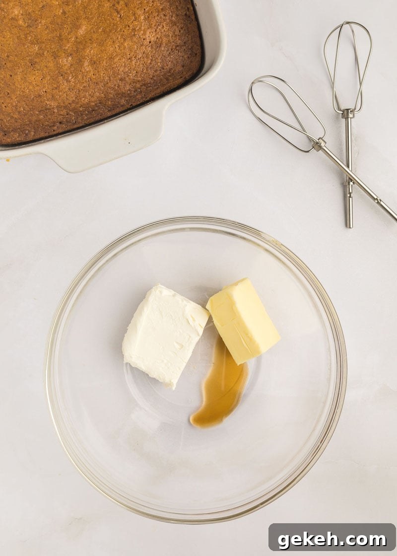 Moist Pumpkin Sheet Cake Recipe with Cream Cheese Frosting 15 A glass bowl with butter, cream cheese and vanilla.