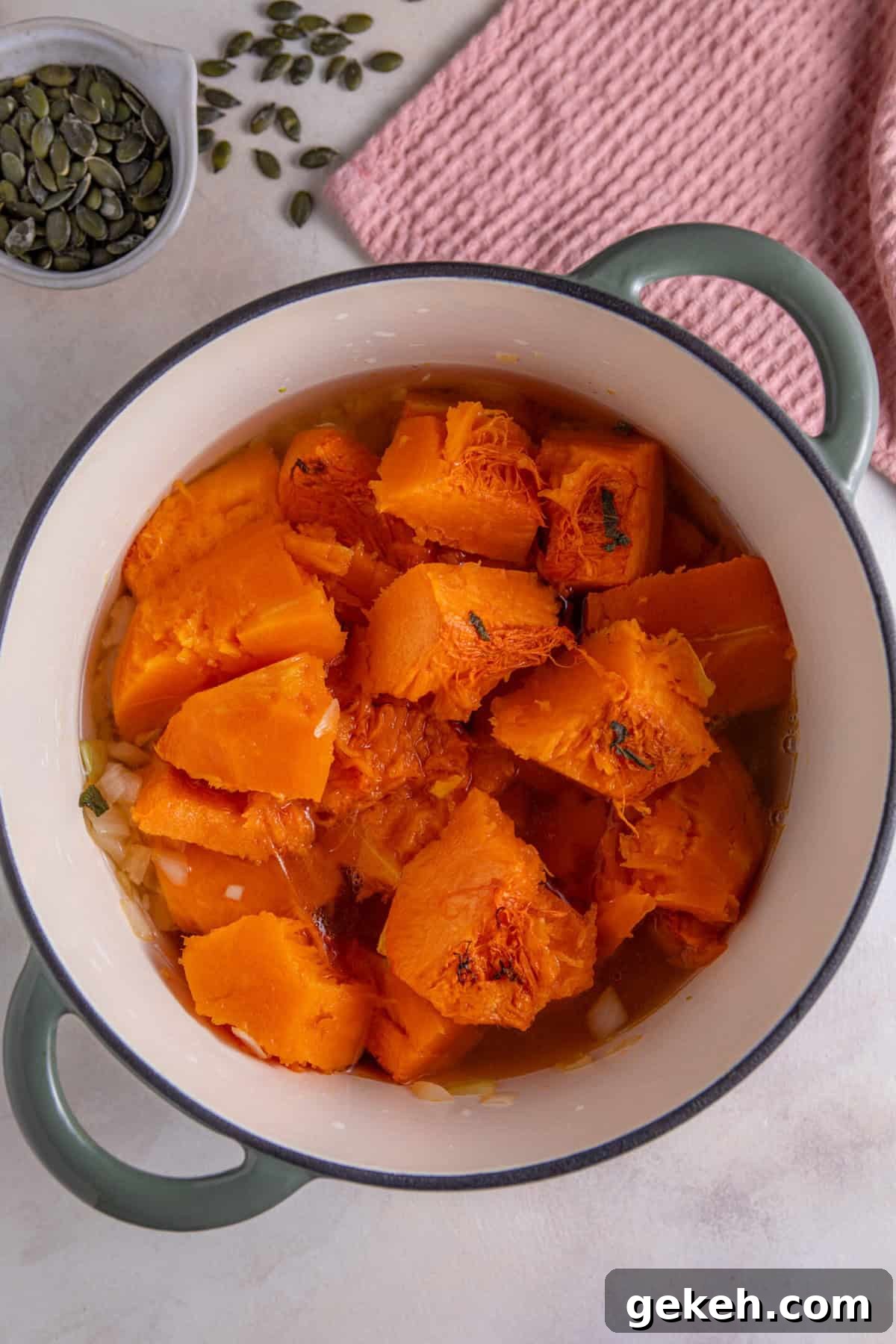 Remove the pumpkin flesh from the skin and add to the pan with the onions.