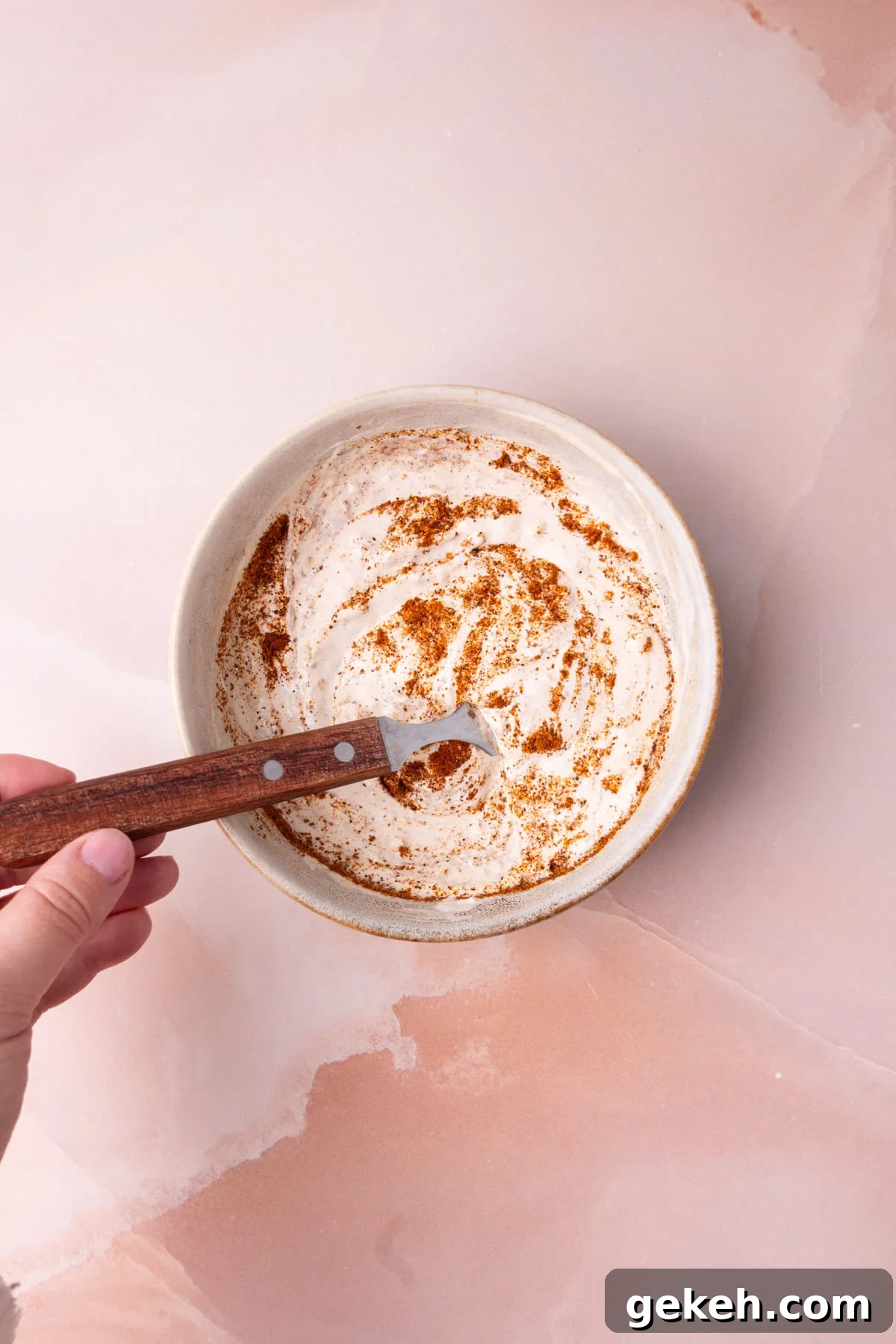 Creamy 3-Ingredient Quesadilla Sauce Recipe 4 Mixing together sour cream, salsa, and taco seasoning to make a dipping sauce for quesadillas.