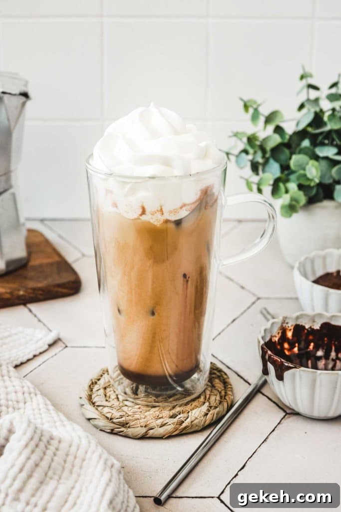 Iced Mocha Latte Recipe: Creamy Chocolate-Coffee Cold Brew 7 glass on a table with an iced coffee mocha