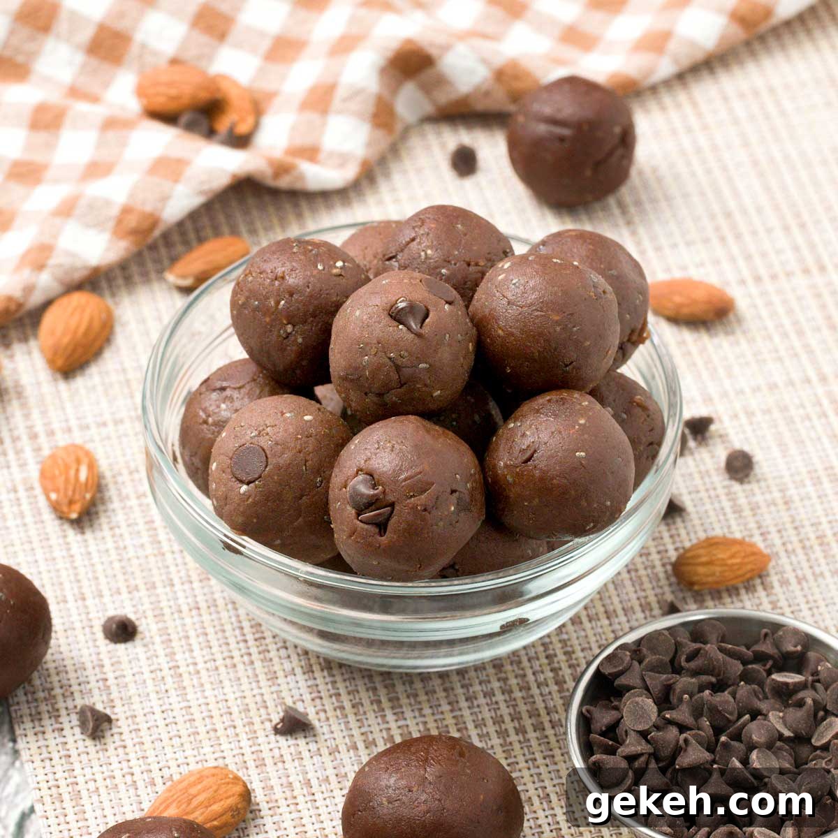 A bowl of chocolate protein balls with chickpeas and protein powder.