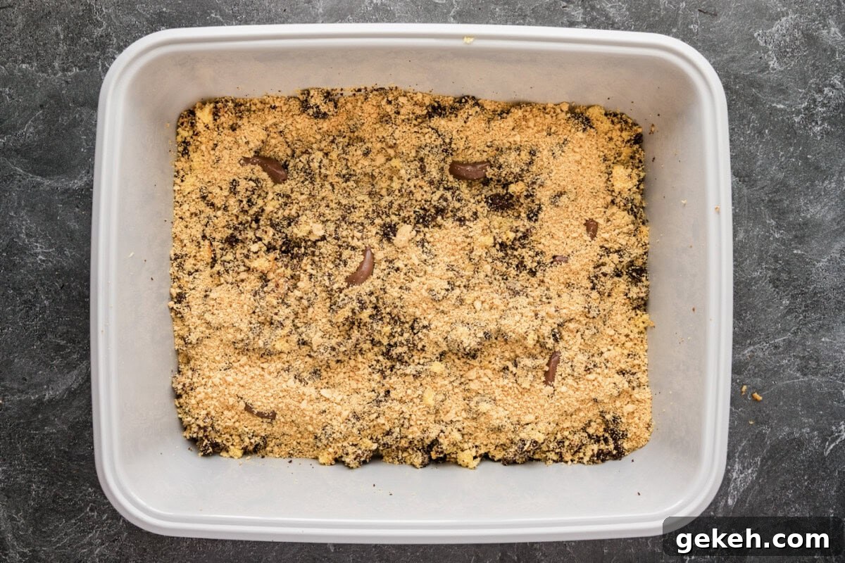 crushed cookies added over cake mixture