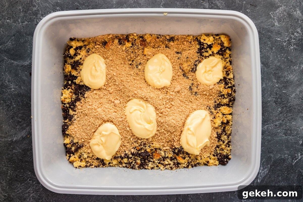 pudding added on top of crushed Oreos and cake