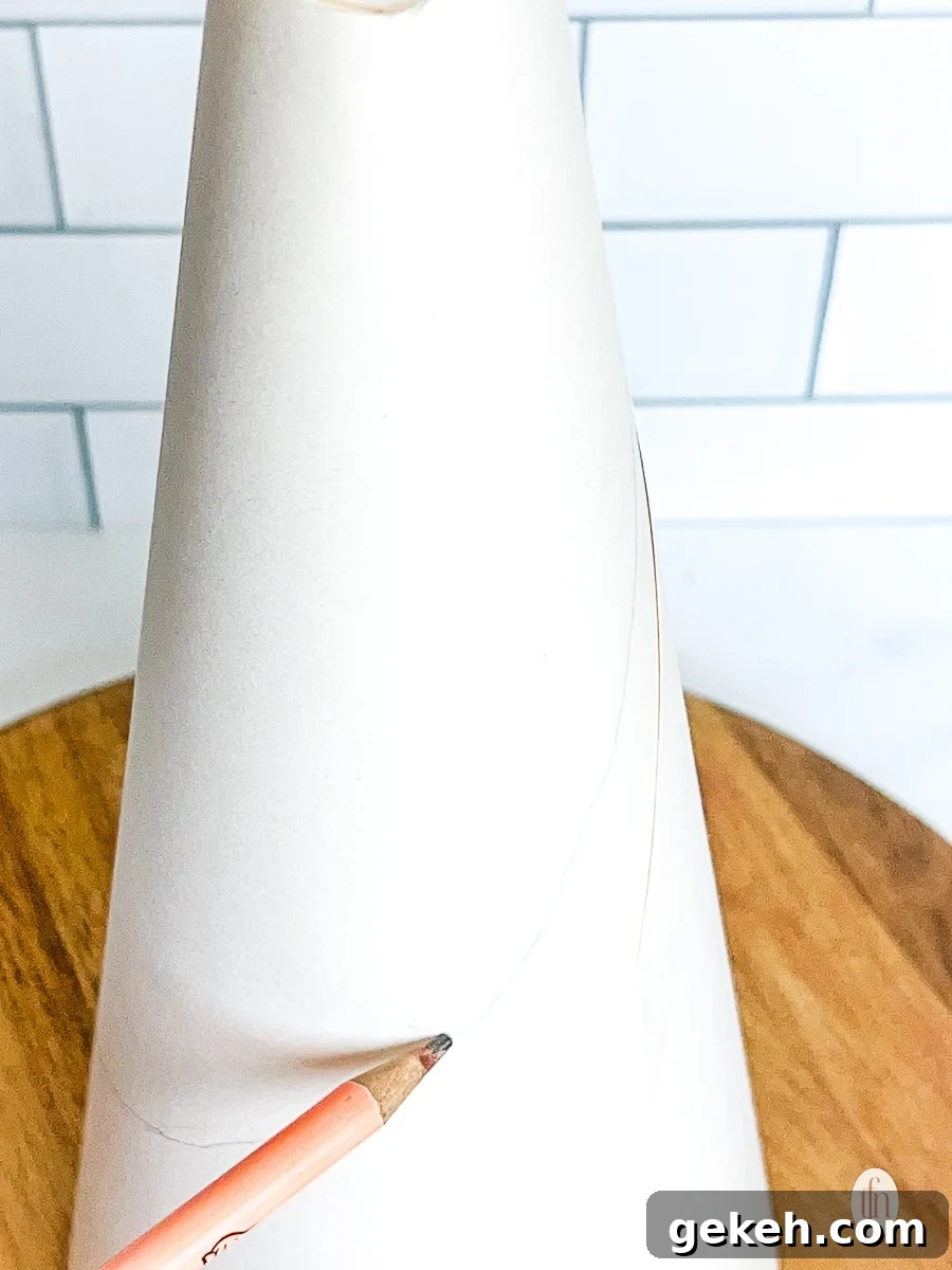 Festive Charcuterie Tree Guide: How to Build a Showstopping Holiday Platter 5 Drawing a line on a styrofoam cone with a pencil.