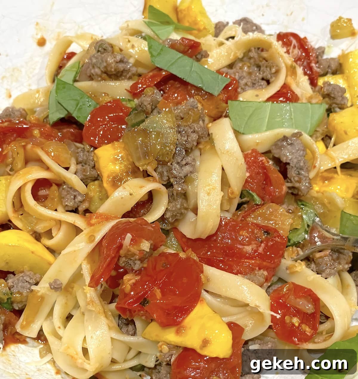 Perfectly Sautéed Summer Squash with Garlic and Herbs 7 Sauteed summer squash with burst cherry tomatoes, fresh basil, ground beef, and pasta.