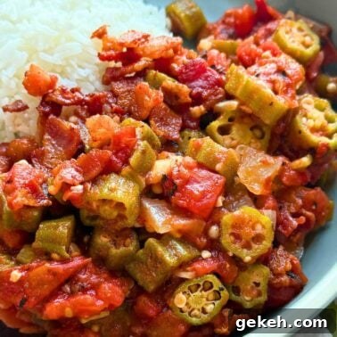 Perfectly Sautéed Summer Squash with Garlic and Herbs 10 A close-up of a plate featuring stewed okra and tomatoes alongside a serving of fluffy white rice.