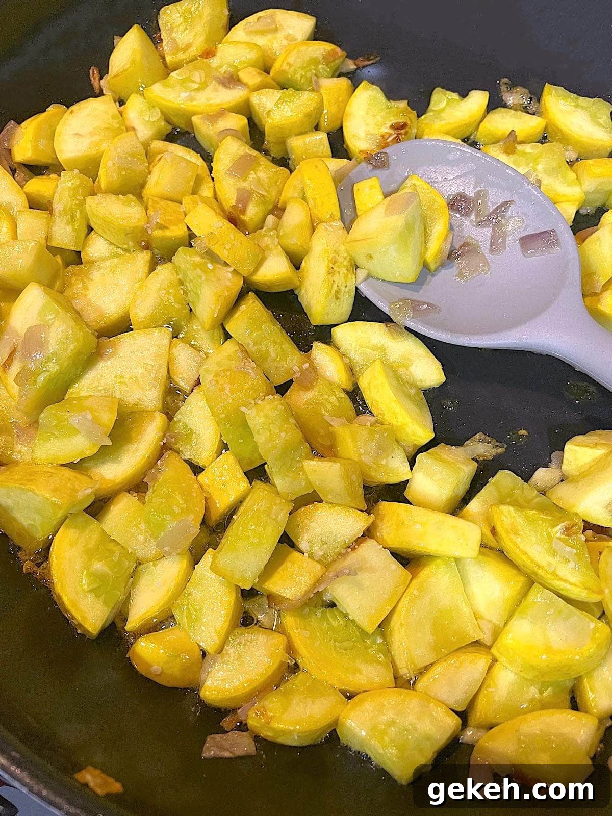 Perfectly Sautéed Summer Squash with Garlic and Herbs 5 A skillet with sauteed yellow squash in it.