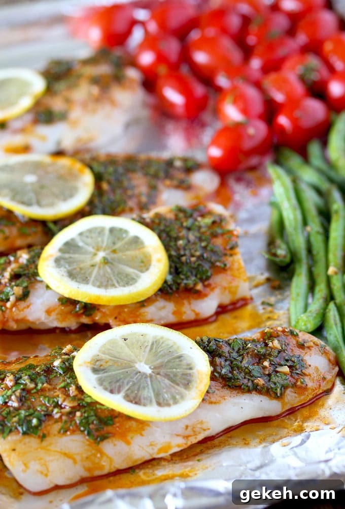 Codfillets and vegetables with chermoula sauce on a sheet pan