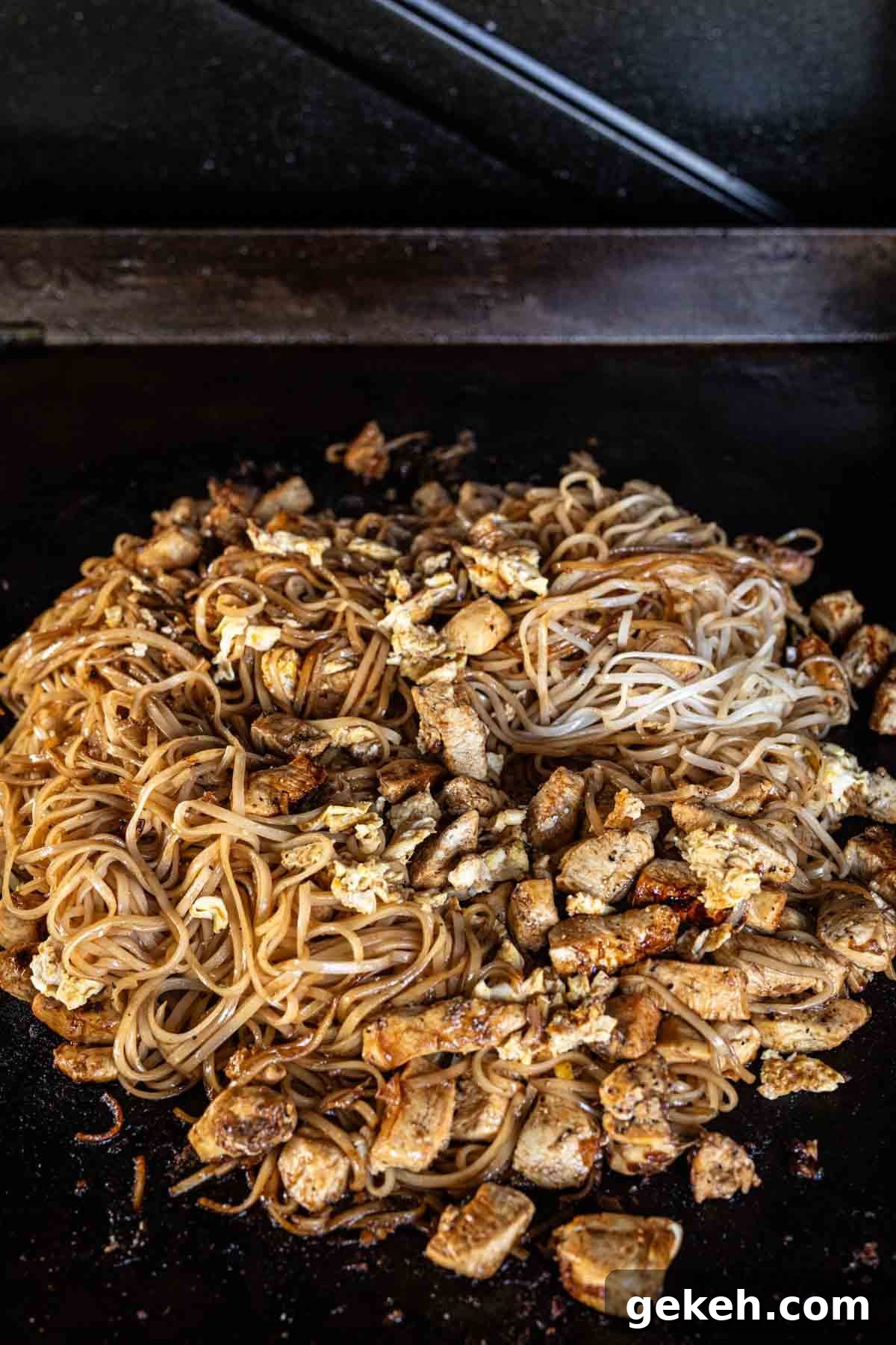 Authentic Pad Thai on a Blackstone Griddle: Simple Recipe 11 Cooking Pad Thai mixture on the griddle