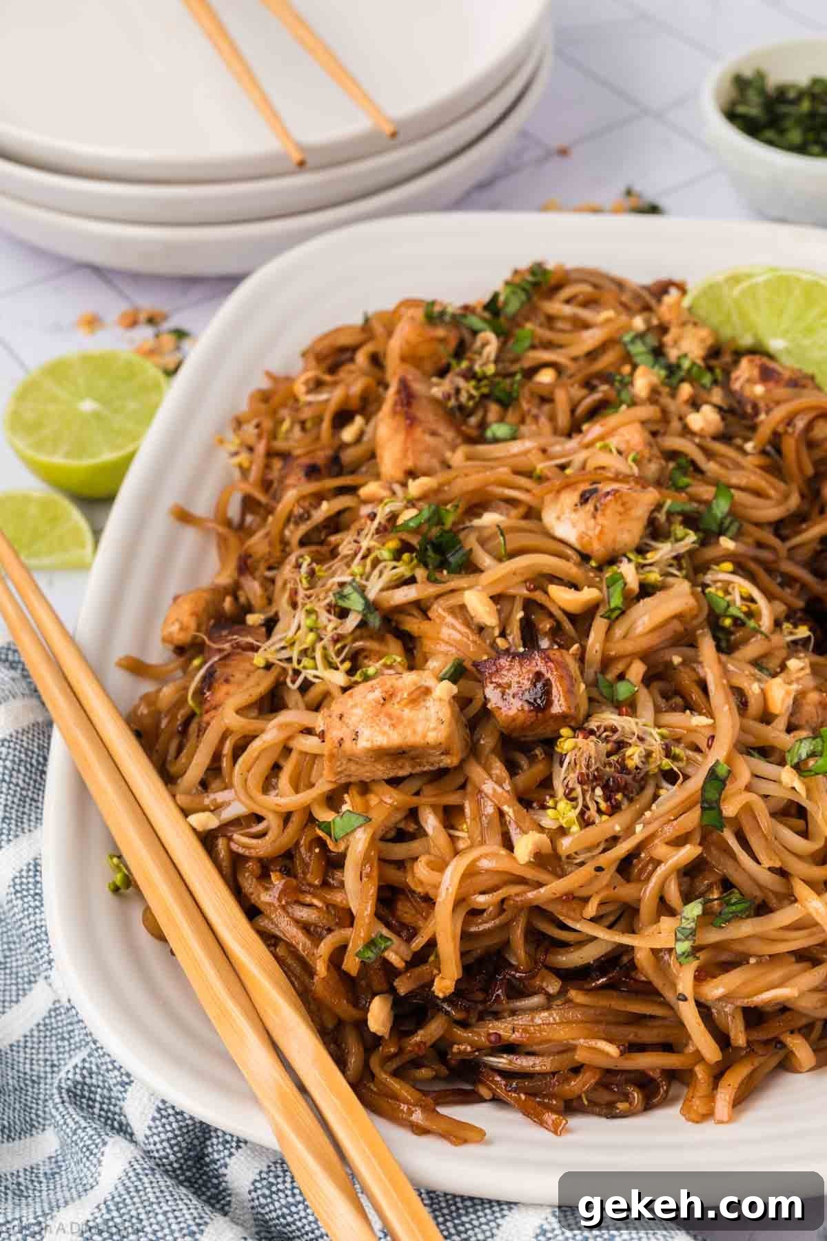 Authentic Pad Thai on a Blackstone Griddle: Simple Recipe 12 A serving of Pad Thai on the a white platter with chopsticks