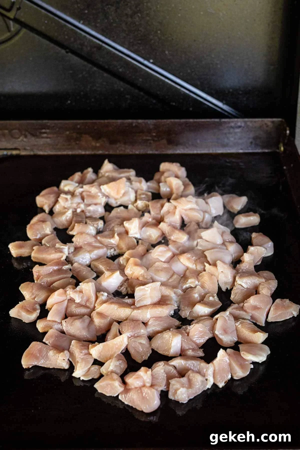 Authentic Pad Thai on a Blackstone Griddle: Simple Recipe 5 Cooking dice chicken on the Blackstone