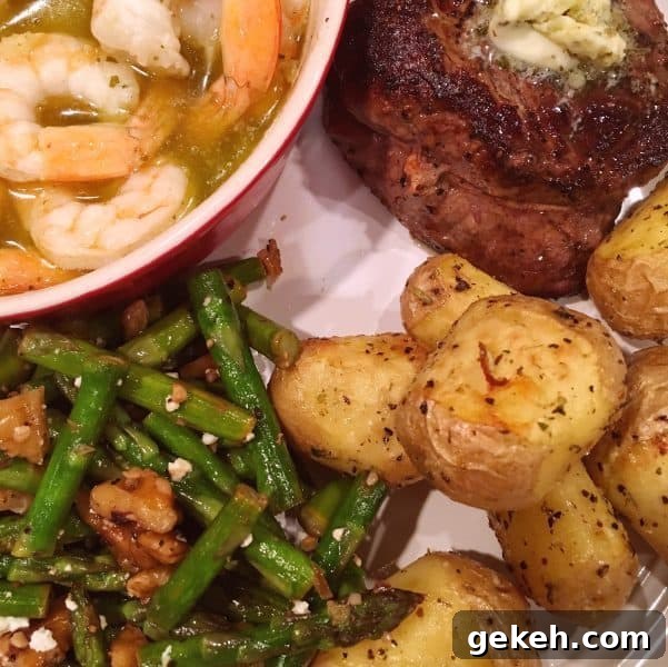 Roasted Asparagus with Toasted Walnuts and Feta 3 Dinner plate with steak, roasted potatoes, lemon butter shrimp, and asparagus side dish