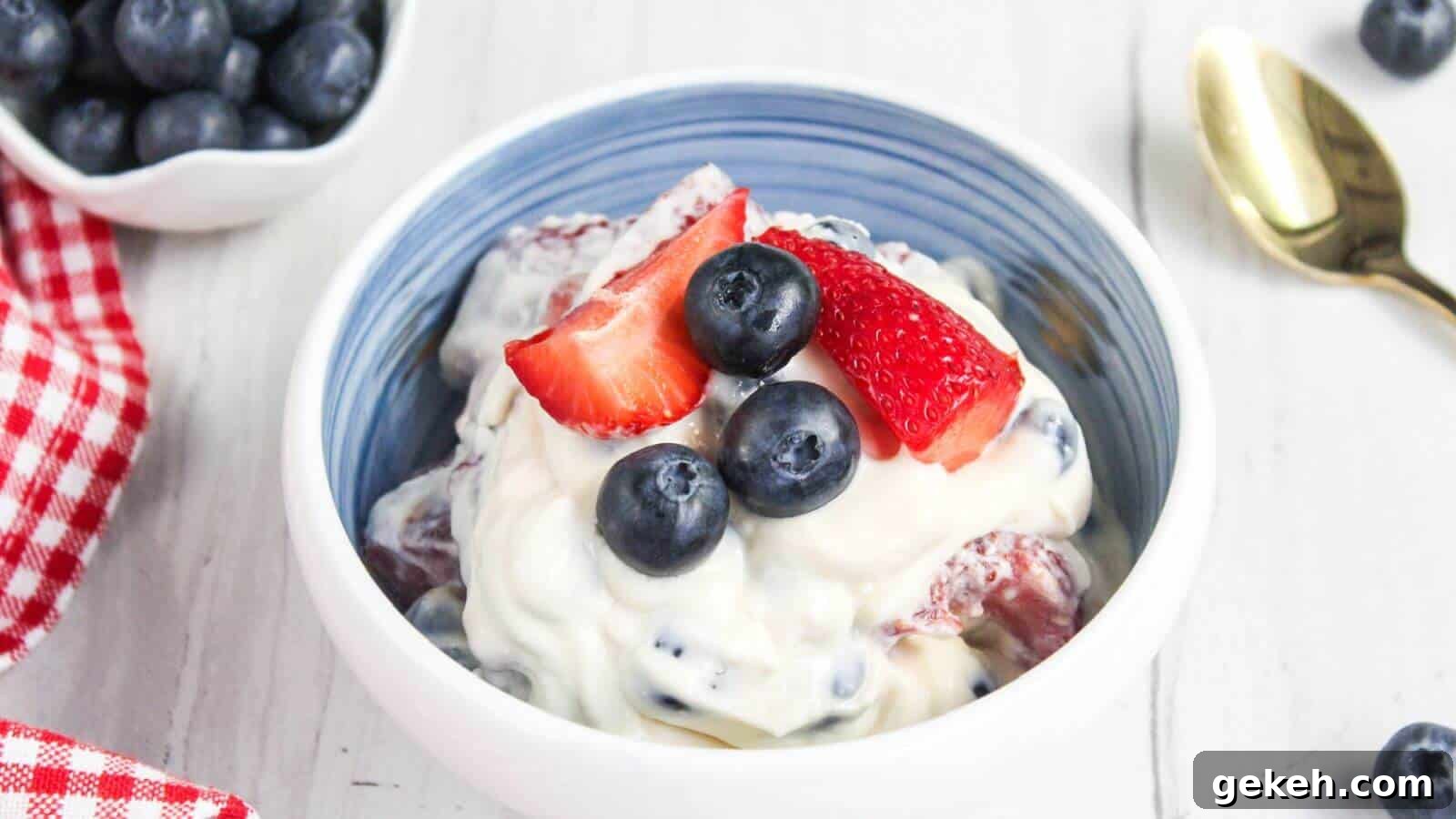 19 Desserts for Two to Share Straight from the Pan 15 A bowl of creamy berry salad topped with fresh blueberries and sliced strawberries.